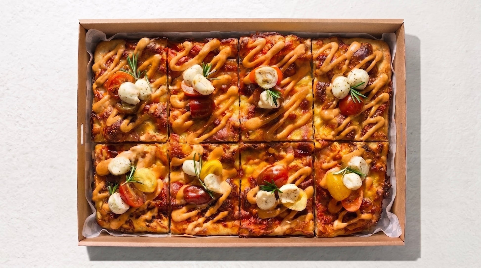 Focaccia Pizza Box (8pc) from Double Dribble — 8 golden focaccia pizza squares (900g dough) with meats, sauce & garnish, priced per piece — office lunch & party catering in Christchurch