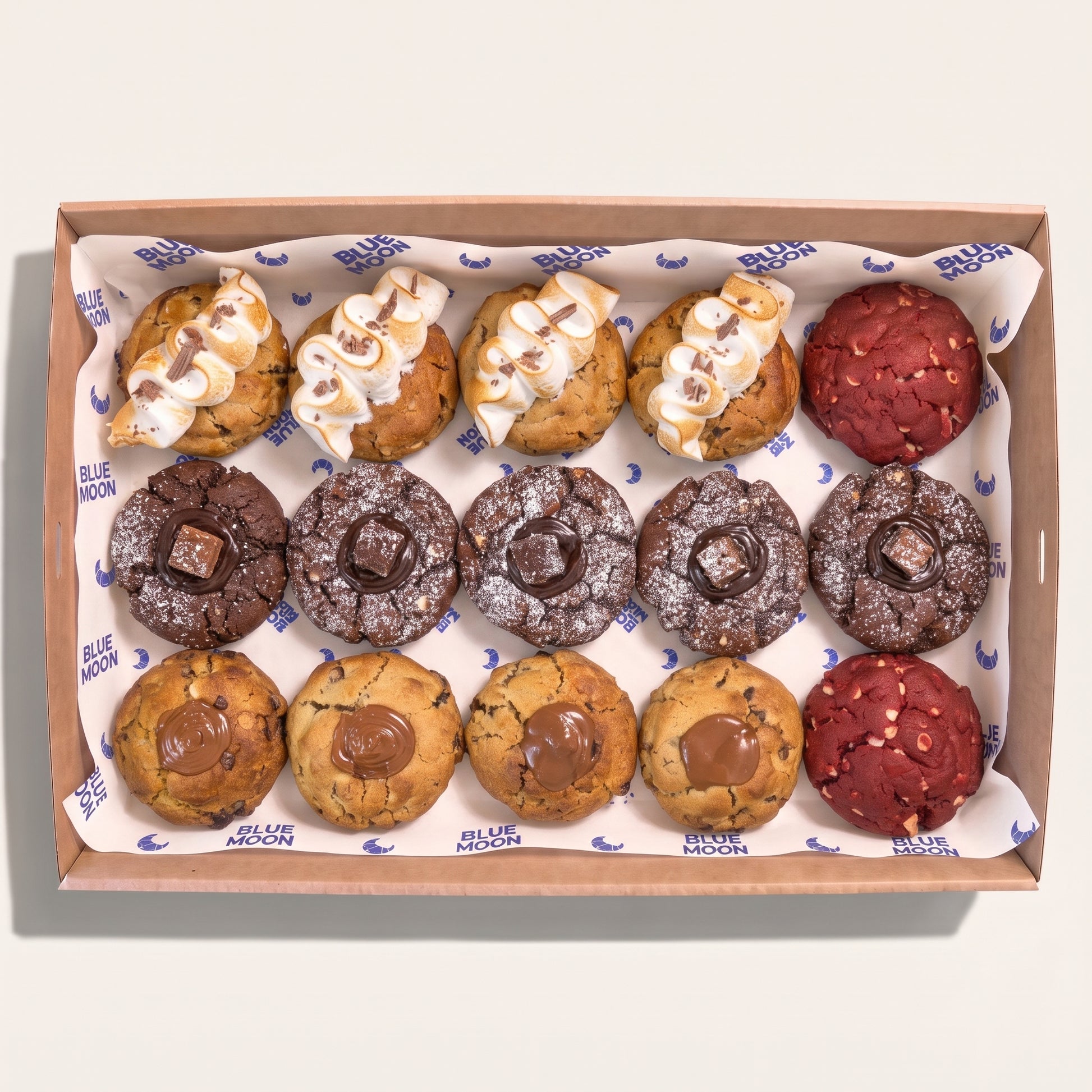 Box of assorted cookies including Red Velvet Chocolate Smores Salted Caramel and Matcha from Blue Moon Bakehouse