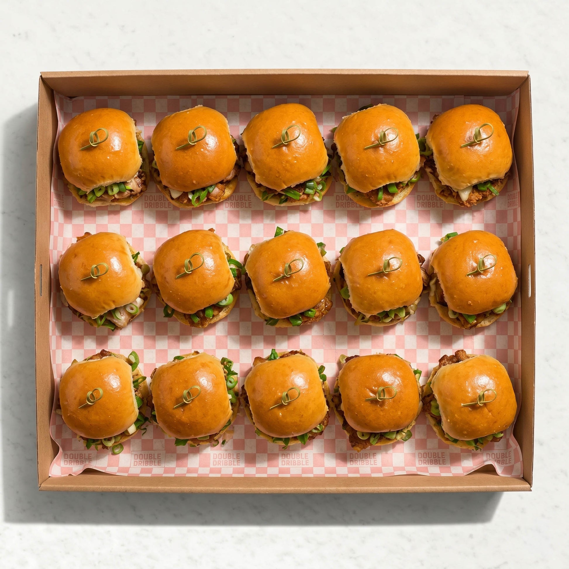 Mini Chicken Burger Box from Double Dribble — bite-sized crispy fried chicken sliders on soft Blue Moon milk buns in a kraft catering box