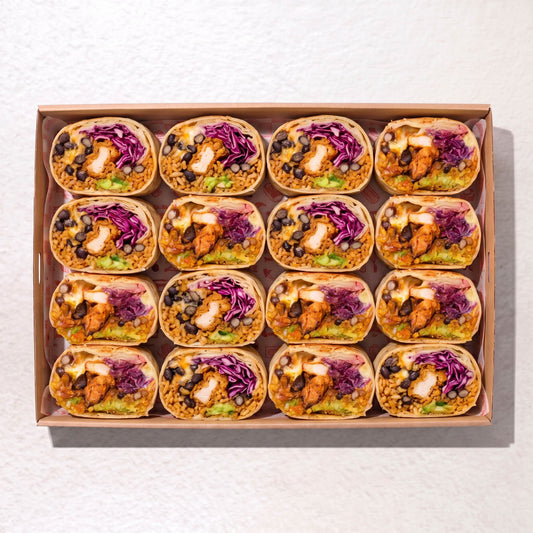 Muy Muy burrito box from Double Dribble Catering Christchurch — soft flour-wrapped burritos with guacamole, black beans, fresh salad and chicken, boxed for sharing.